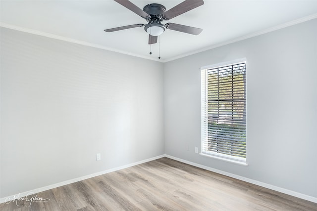 spare room with ornamental molding, light hardwood / wood-style flooring, and ceiling fan