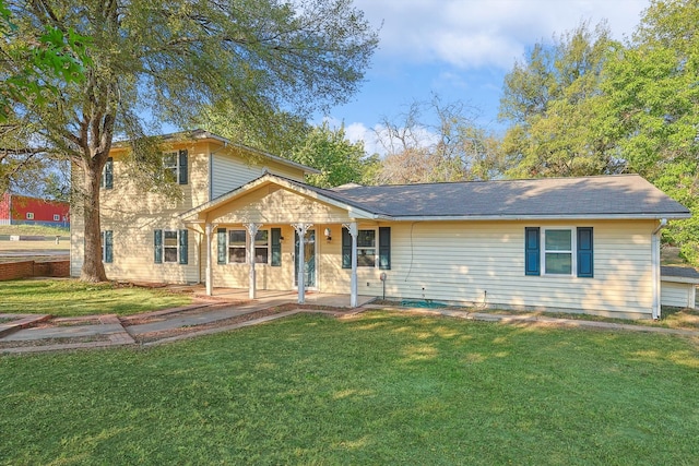 view of front of house with a front yard and a porch