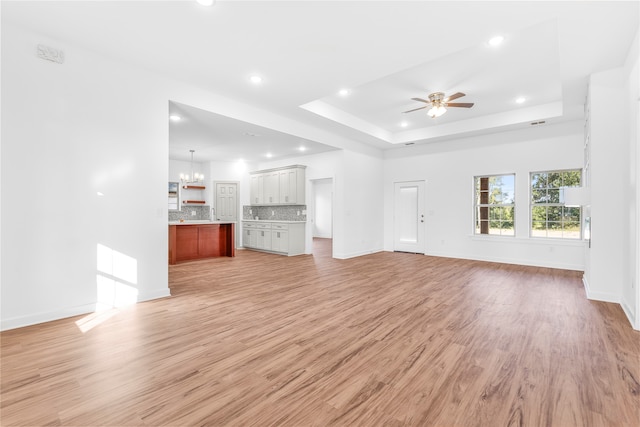 unfurnished room with ceiling fan and light wood-type flooring