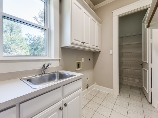 laundry area featuring washer hookup, cabinets, crown molding, sink, and electric dryer hookup