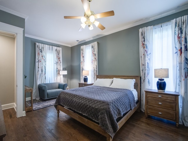 bedroom with dark wood-type flooring, crown molding, multiple windows, and ceiling fan