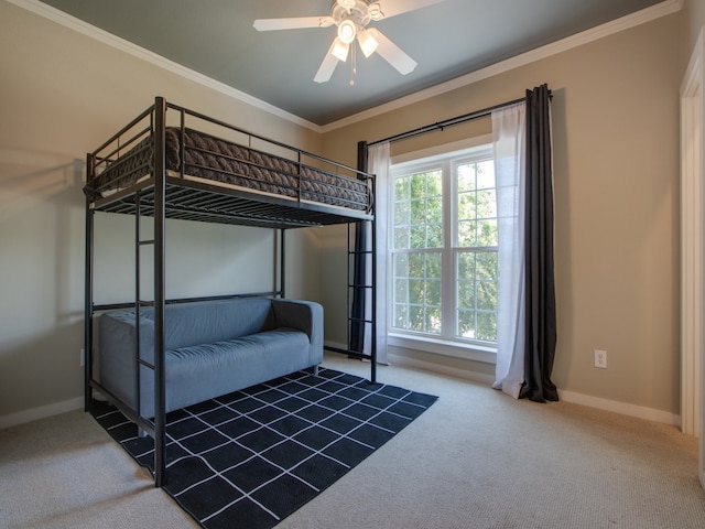 unfurnished bedroom with ceiling fan, carpet floors, and ornamental molding