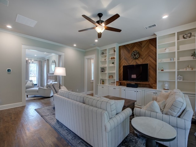 living room with ceiling fan with notable chandelier, dark hardwood / wood-style floors, and ornamental molding