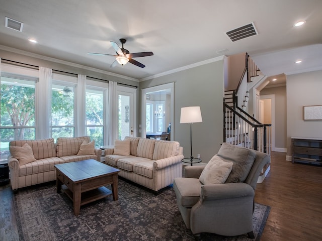 living room featuring ornamental molding, dark hardwood / wood-style flooring, and ceiling fan