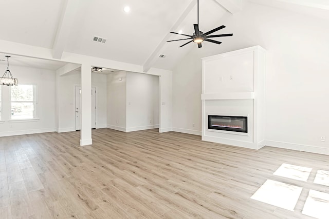 unfurnished living room featuring ceiling fan with notable chandelier, light hardwood / wood-style floors, beamed ceiling, and high vaulted ceiling