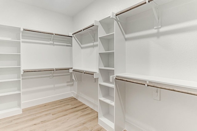 walk in closet featuring light hardwood / wood-style floors