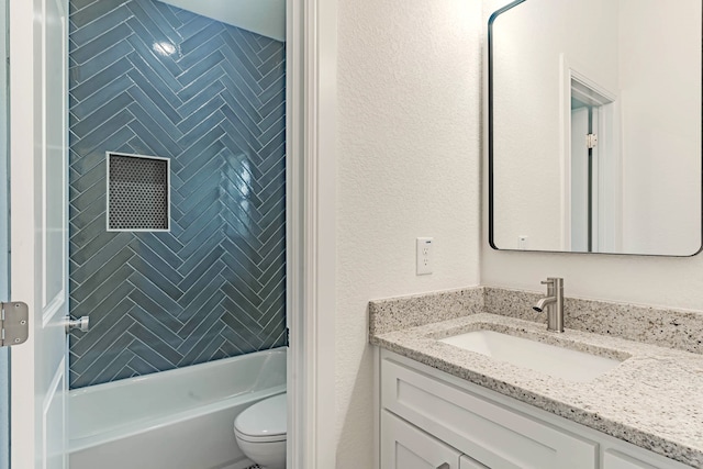 full bathroom featuring vanity, toilet, and tiled shower / bath