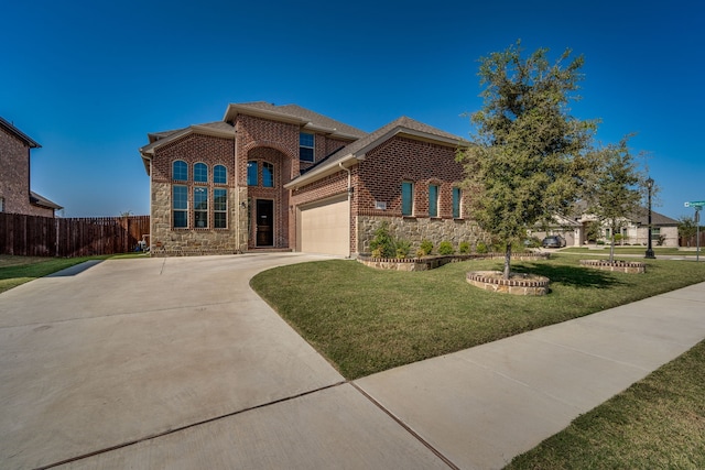 view of front of property with a garage and a front yard