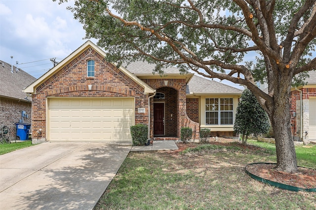 view of front facade with a front yard and a garage