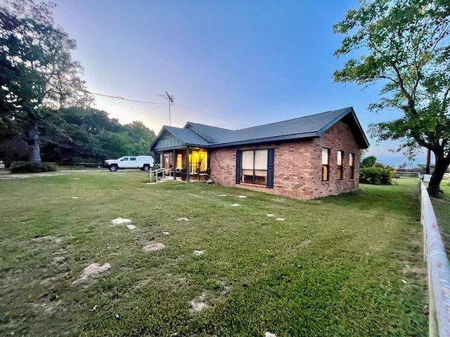 view of property exterior featuring a lawn