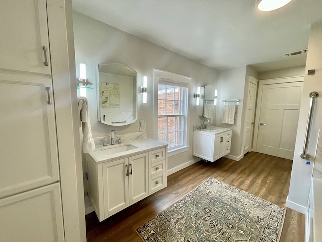 bathroom featuring vanity and wood-type flooring