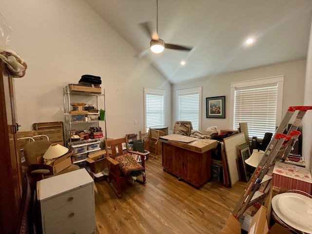 office with ceiling fan, dark hardwood / wood-style floors, and high vaulted ceiling