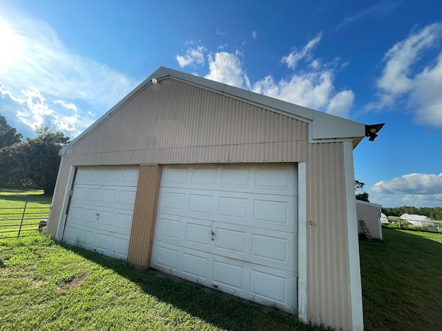 garage featuring a yard