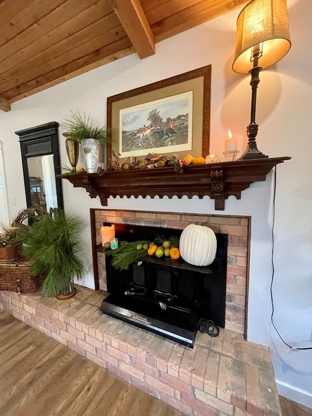 details featuring beamed ceiling, wooden ceiling, and hardwood / wood-style flooring