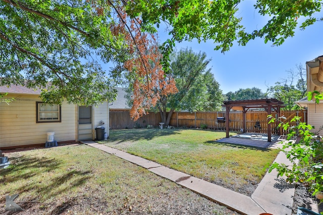 view of yard with a deck and a pergola