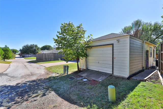 garage with a yard