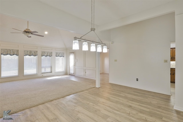 spare room with high vaulted ceiling, ceiling fan, and light hardwood / wood-style flooring