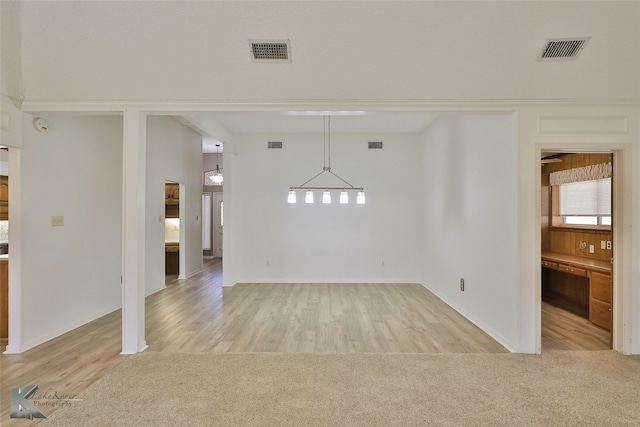 unfurnished room featuring light hardwood / wood-style floors