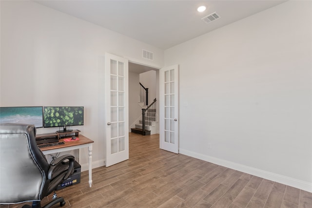 office area featuring french doors and light wood-type flooring