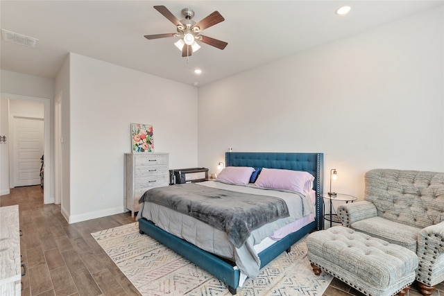 bedroom with ceiling fan and hardwood / wood-style floors