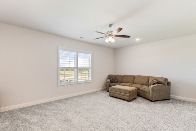 living room with ceiling fan and light carpet