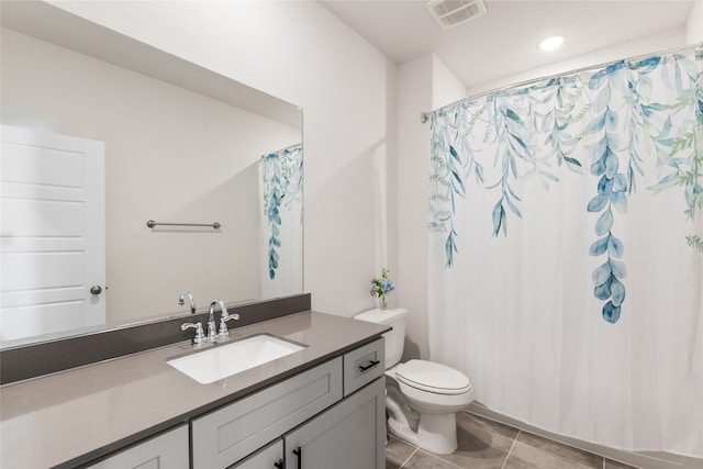 bathroom with tile patterned floors, vanity, toilet, and a shower with shower curtain