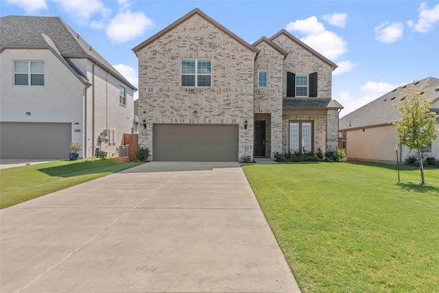 view of front facade featuring a front yard and a garage