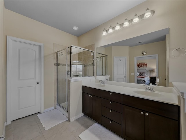 bathroom with vanity and an enclosed shower