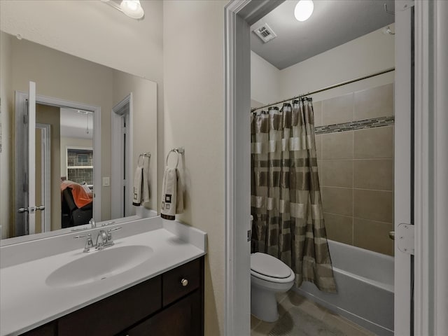 full bathroom with shower / bath combination with curtain, toilet, and vanity