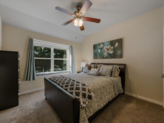 carpeted bedroom featuring lofted ceiling and ceiling fan