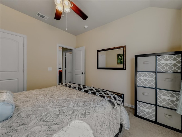 carpeted bedroom with lofted ceiling and ceiling fan