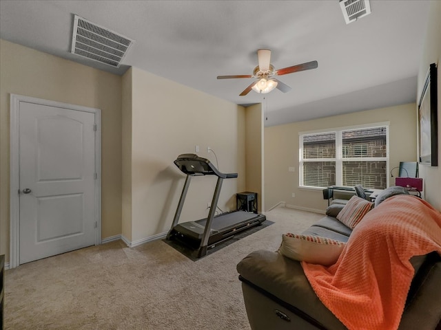 workout room with light colored carpet and ceiling fan