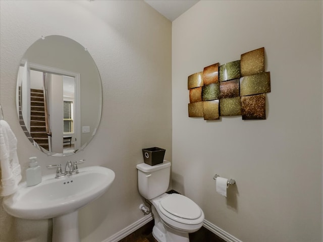 bathroom with sink and toilet