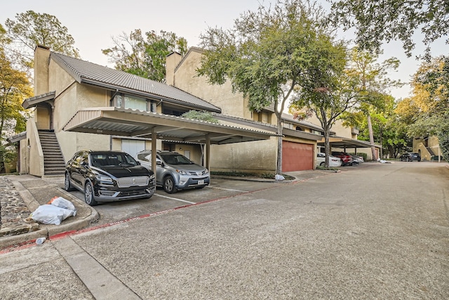 view of vehicle parking featuring a carport