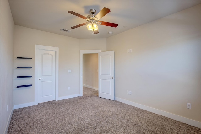 unfurnished bedroom with ceiling fan and carpet