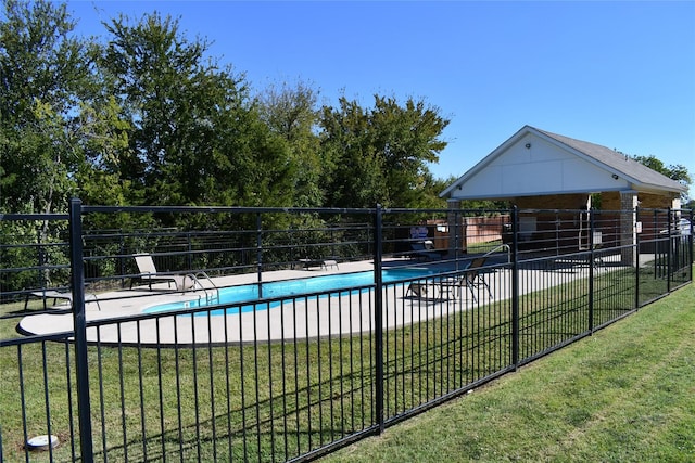 view of pool with a yard and a patio