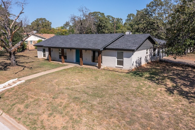 ranch-style house featuring a front lawn