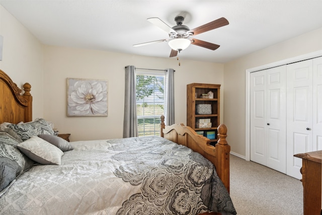 carpeted bedroom featuring ceiling fan and a closet