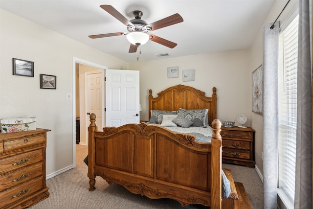 bedroom with light carpet and ceiling fan