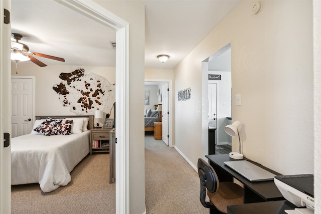 carpeted bedroom featuring ceiling fan