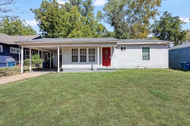 view of front of property with a carport and a front yard