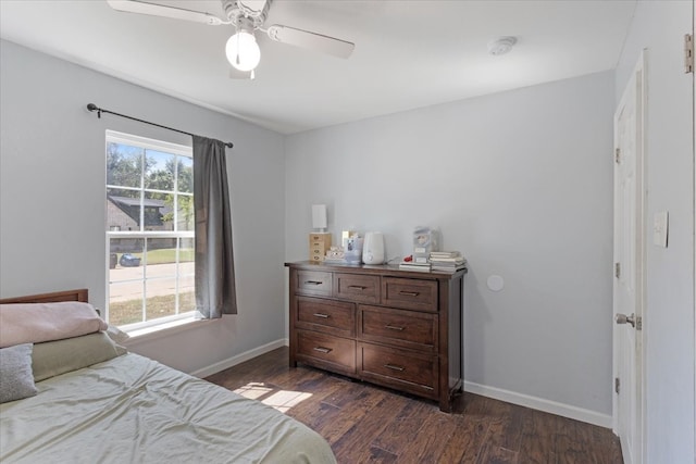 bedroom featuring ceiling fan and dark hardwood / wood-style floors