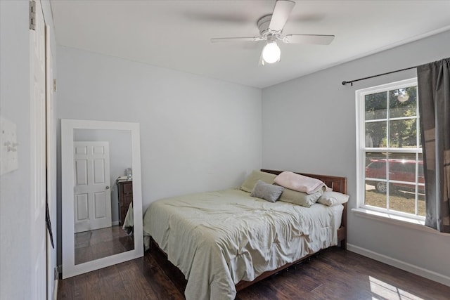 bedroom with dark wood-type flooring and ceiling fan