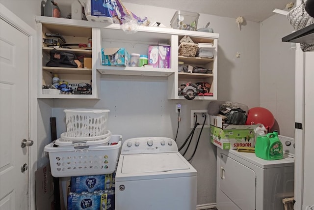 washroom featuring washer and clothes dryer