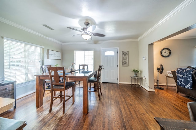 dining space featuring ceiling fan, ornamental molding, and dark hardwood / wood-style flooring