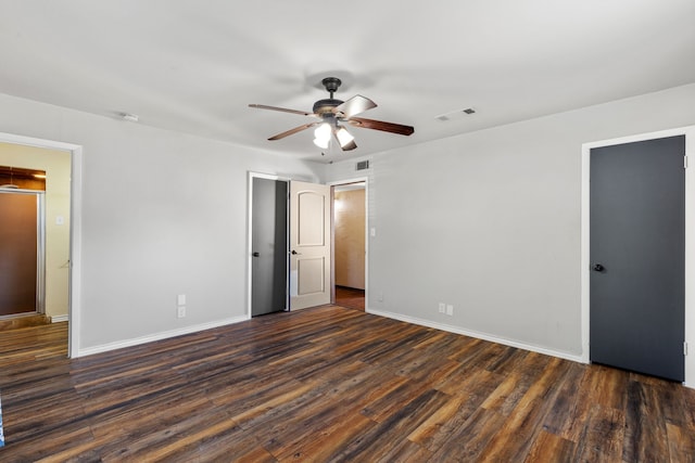 unfurnished bedroom featuring ceiling fan and dark hardwood / wood-style floors