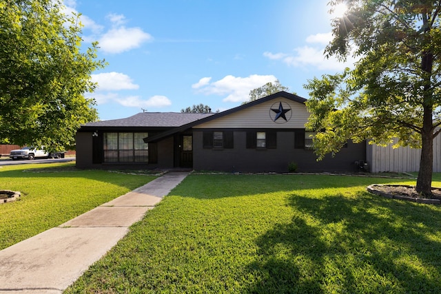 ranch-style house with a front lawn