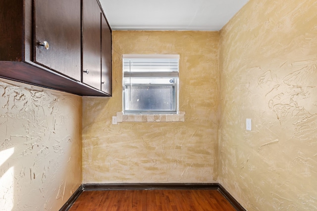 unfurnished room with hardwood / wood-style flooring