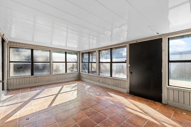 unfurnished sunroom featuring plenty of natural light