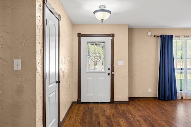 doorway to outside featuring dark hardwood / wood-style floors